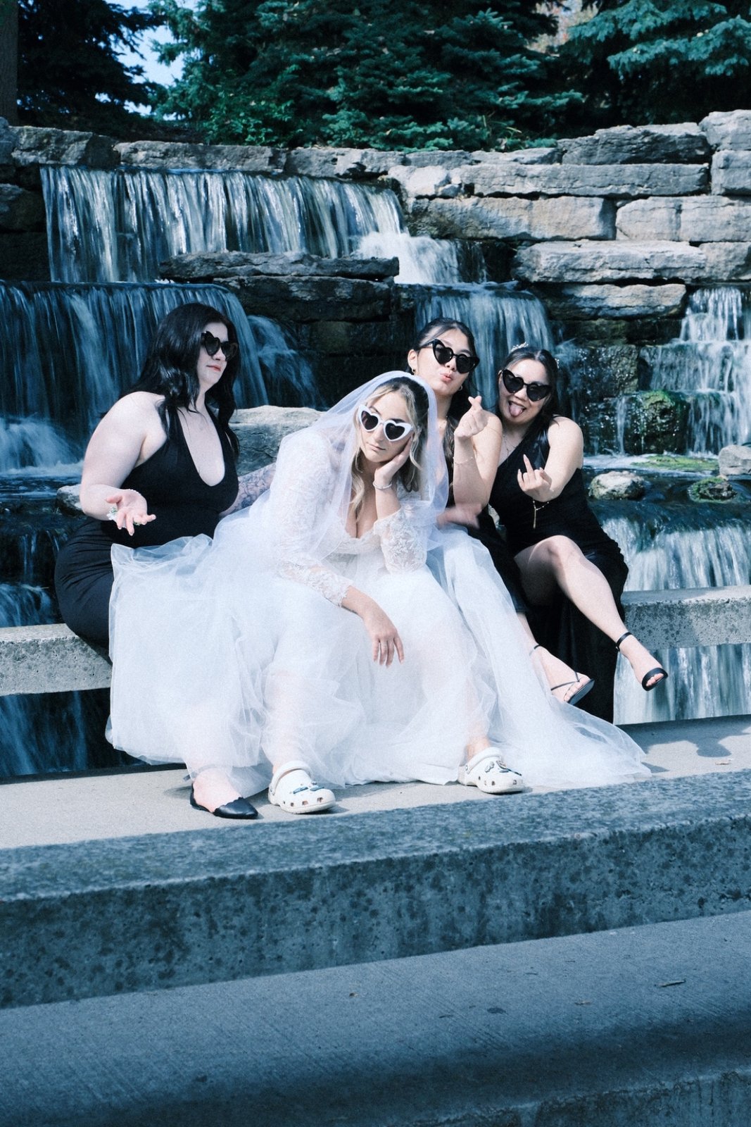 Bride and bridesmaids at a waterfall